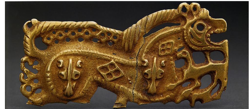 Figure 28. Gold Ornament in the Shape of a Tiger and Dog from Xiaobazitan Site, Liangcheng County Wulanchabu City. 265-316.  Source: Chengjisihan: Zhongguo gudai beifang caoyuan youmu wenhua (Beijing: Beijing chubanjituan, 2004), 143. 