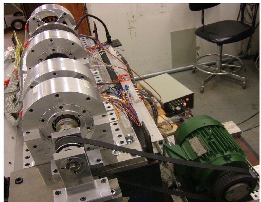 Side view of the test rig showing the rotor, four amb