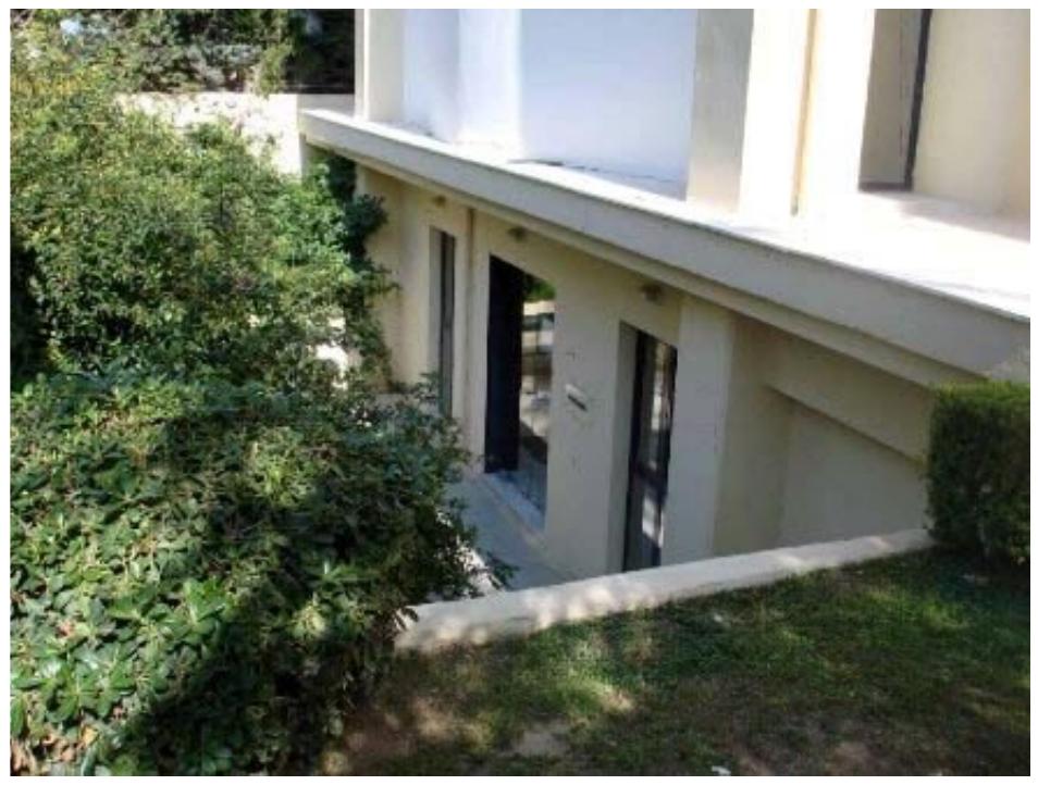 Fig.6 The basement of an office building turned into bureau.  Basement storage and open ground-level spaces are frequently built up, used either as living or business space. This illegal conversion occurring both in apartment and business buildings, generates a series of problems. More specifically, this violation of building permit supersedes the approved legal building rate, increasing the number of residents and the total floor space of the building not complying with the permit issued (figure 6).  