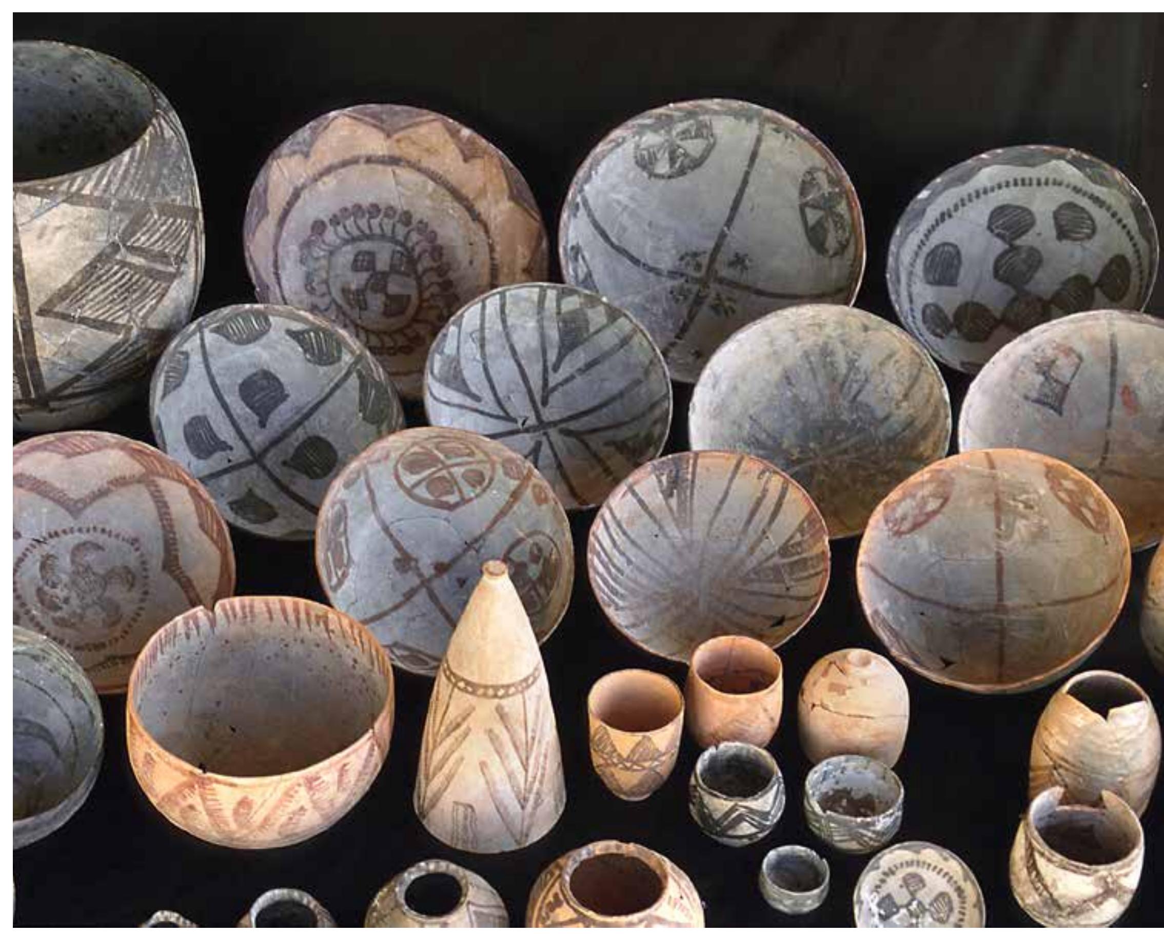 these graves. Ceramics evidently play an important part in the burial practices of Period Illa. The forms found in the graves include vessels used for the consumption and storage of food and liquids, forms that could have been used for banqueting at the funerals or to provide provisions for the dead. The other objects in the burials include stone vessels; copper objects such as a mirror, an impressive copper-lead weight with a sea-shell decoration’* (Fig. 11.14), and compartmented seals (Fig. 11.15); sea-shell bangles similar to those from Period Il; and a broader variety of necklaces 