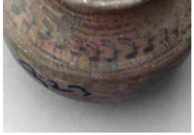 bands are painted on the rim and neck. The decoration on the shoulder shows a frieze of stylised ibexes. Below, a frieze of 