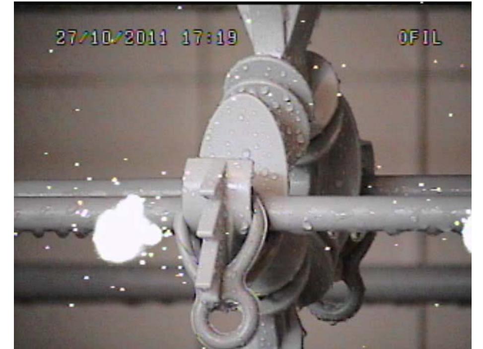 Figure 4. Typical corona identification during the ageing test, as observed not on the interfaces but along the cable — Two occurrences one close to the spacer insulator — that developed to a full short circuit and other on the right quite close to edge of the picture. 