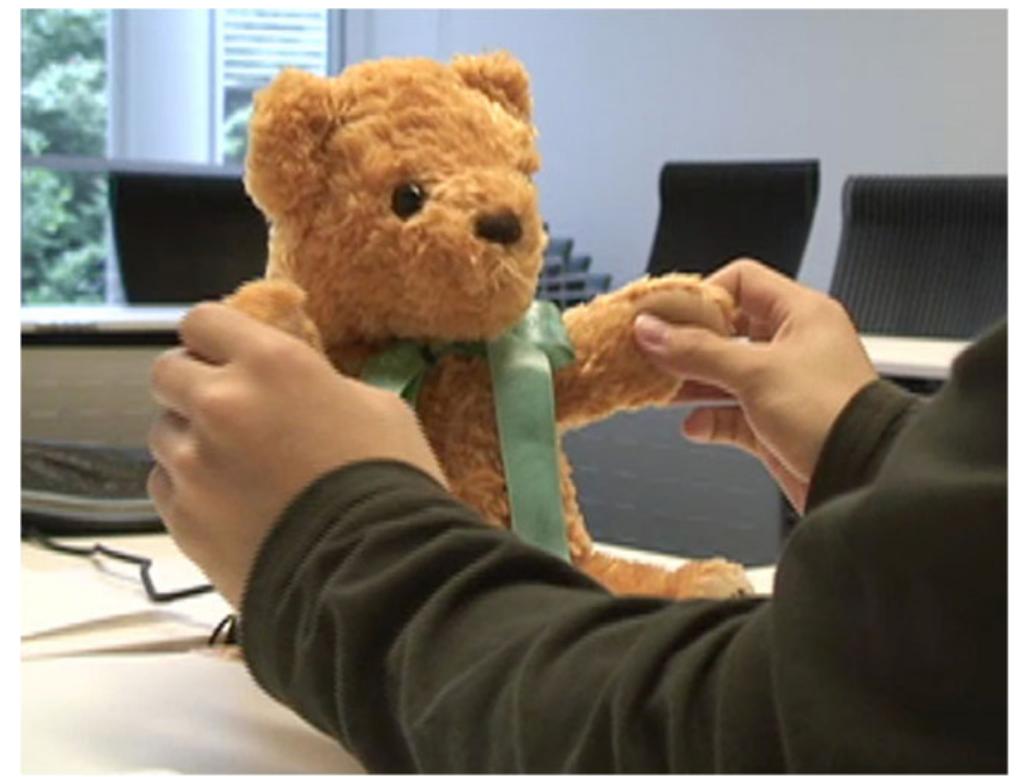 Participant manipulating robot used in this study to