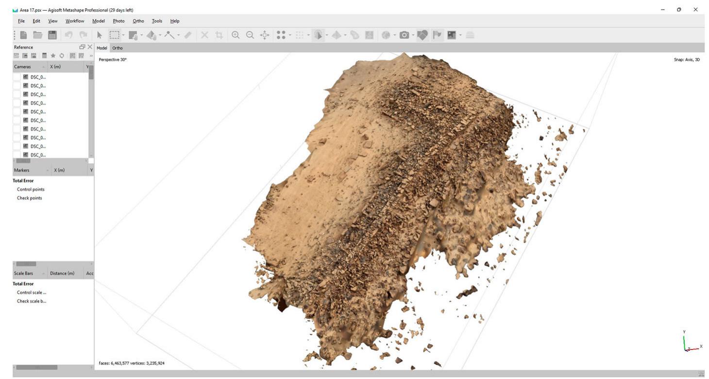 Figure 3. Trial model of section of casemate wall. Image courtesy of the author.  Having achieved our initial goals earlier than expected we had time to also investi- gate the site’s eastern slope, on which previous investigations spotted remains of three  cisterns (Routledge pers. unknown built road lead total of 16 cisterns whic These cisterns were in d  comm.). On this slope we found remains of a previously ing down towards the wadi. We furthermore discovered a h were cut into the hill’s soft limestone layers (see Fig. 4). ifferent states of preservation, some being near completely  sanded up whereas others were remarkably well-preserved. The inner walls of several of these well-preserved cisterns held remains of plaster, which were sampled  for further study at the  University of Liverpool. The reinforced road led down to a  final retaining wall guarding access up the slope to the cisterns. Protruding from 
