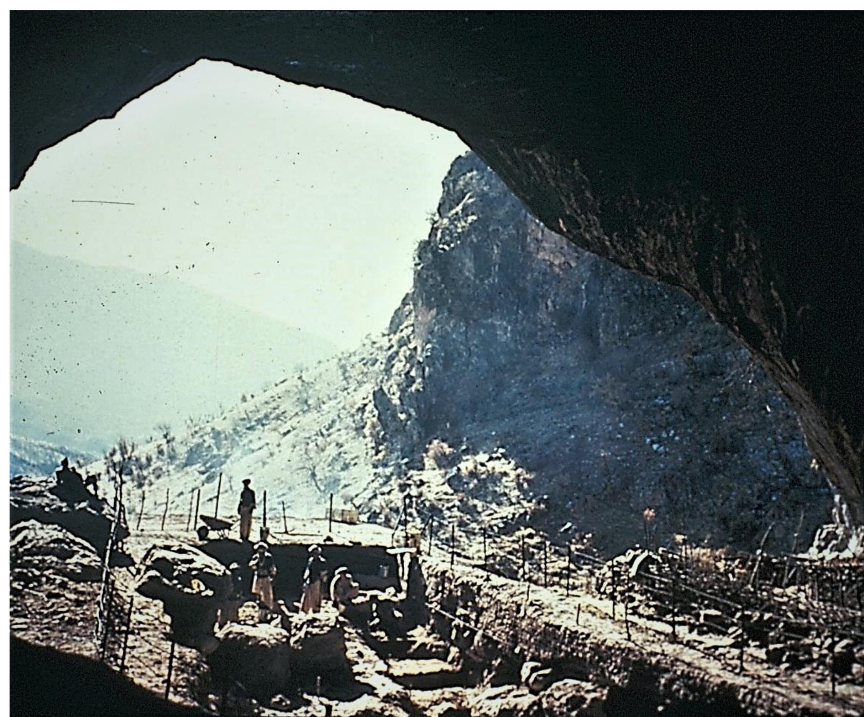 Figure 2. Excavations at the central front area of Shanidar Cave directed by Prof. Ralph Solecki in the late 1950s. At the right perimeter of the cave there are visible the “animal corrals of Sherwani Kurds who habitually seek shelter in the cave during the cold win-  ter seasons”. Image and quote courtesy of my doctoral advisor Prof. Ralph Solecki +. 