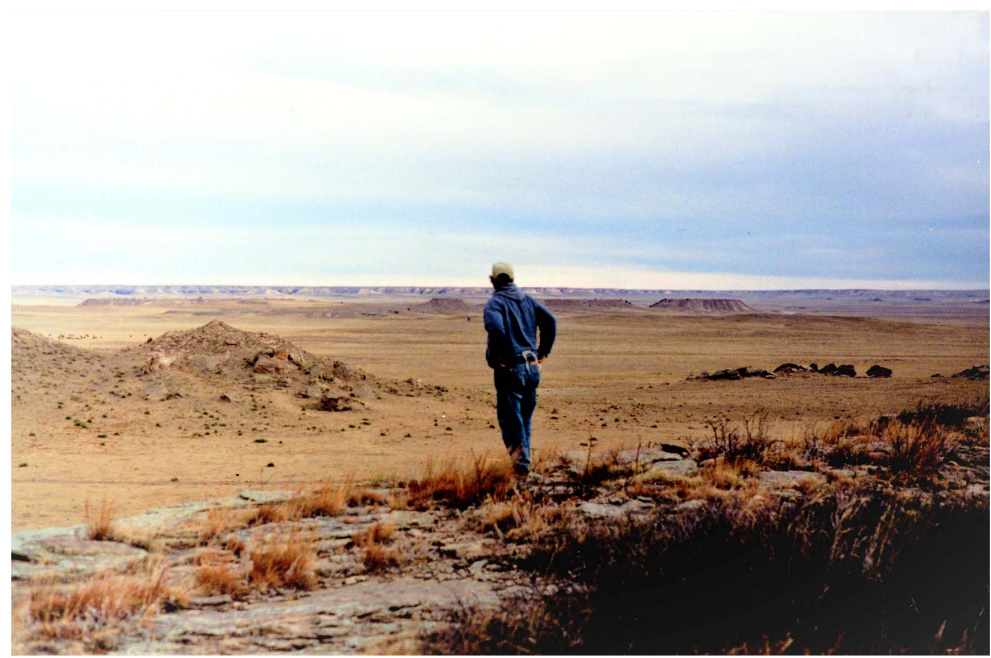 Figure 1. Mike Toft standing near the Dipper Gap site in Logan County, Colorado. The High Plains meet the Colorado Piedmont here, in a land of buttes, cedar-filled canyons, and springs. (Photo courtesy of Mike Toft.) 
