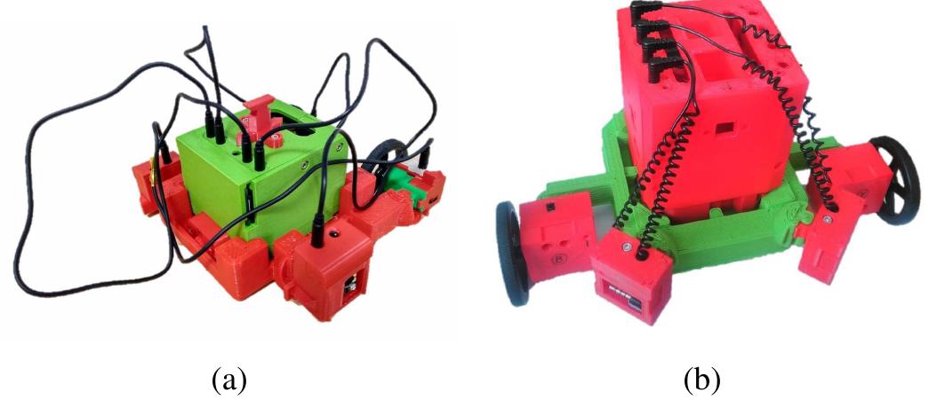 Fig. 1: Early physical iterations of the organs used to create some hand-designed test robots, showing (a) the tangle-prone cables, and (b) the self-retracting, coiled cables used to reduce this problem. 