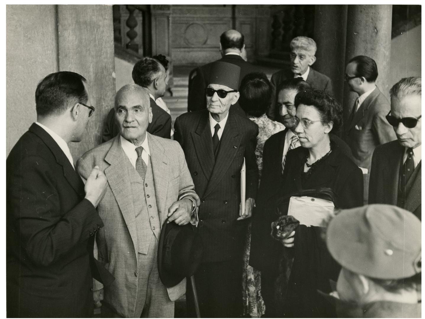 Conference Islam’s Judgment on Western Civilisation (Convegno Processo dell’Islam alla societa occidentale), Fondazione Giorgio Cini, 1955. From the left, Hassan Taqizadeh (in light jacket), Hassan Husni Abdul-Wahab (wearing hat), Maria Nallino, Taha Hussein. Archive of the Institute of History of Art, Fondazione Giorgio Cini,  Venezia. 