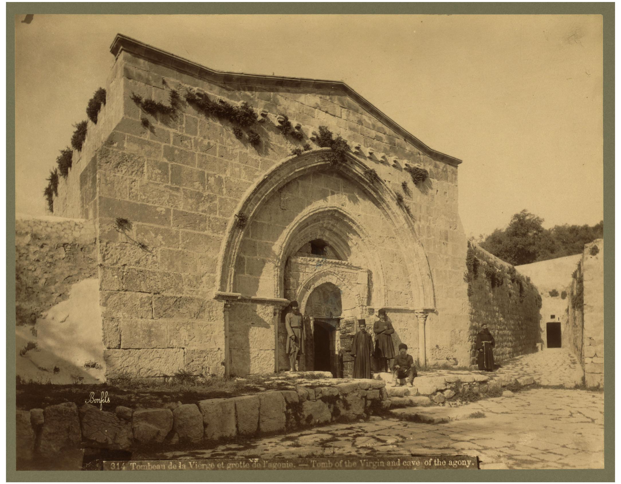 Fig, 3. Tomb of the Virgin and cave of the agony. Photograph by Maison Bonfils, Between 1867 and 1899. Jerusalem, https://wwwloc.gov/item/2004669849/.   of Gethsemane. The motives for delegitimizing the Christian churches had two aspects. The first is the connection of these churches with the locale called the Valley of Gehenna, because of the belief that the gate to Hell stood east of the Temple Mount. This identification made it inadvis- able for Muslim prayer. The second aspect was the presence of two pillars, those that the Christian traditions locate in the Church of the Ascension and describe as having magic properties. Muslim interpretation identifies them as idols and, subverting their virtues according to the Christian lore, states that the two columns/idols can invalidate the spirit of devotion possessed by the believers once they enter the church.  Nasser Rabbat, “The Meaning of Umayyad Dome of the Rock,” Mugarnas 6 (1989), footnote 58. 