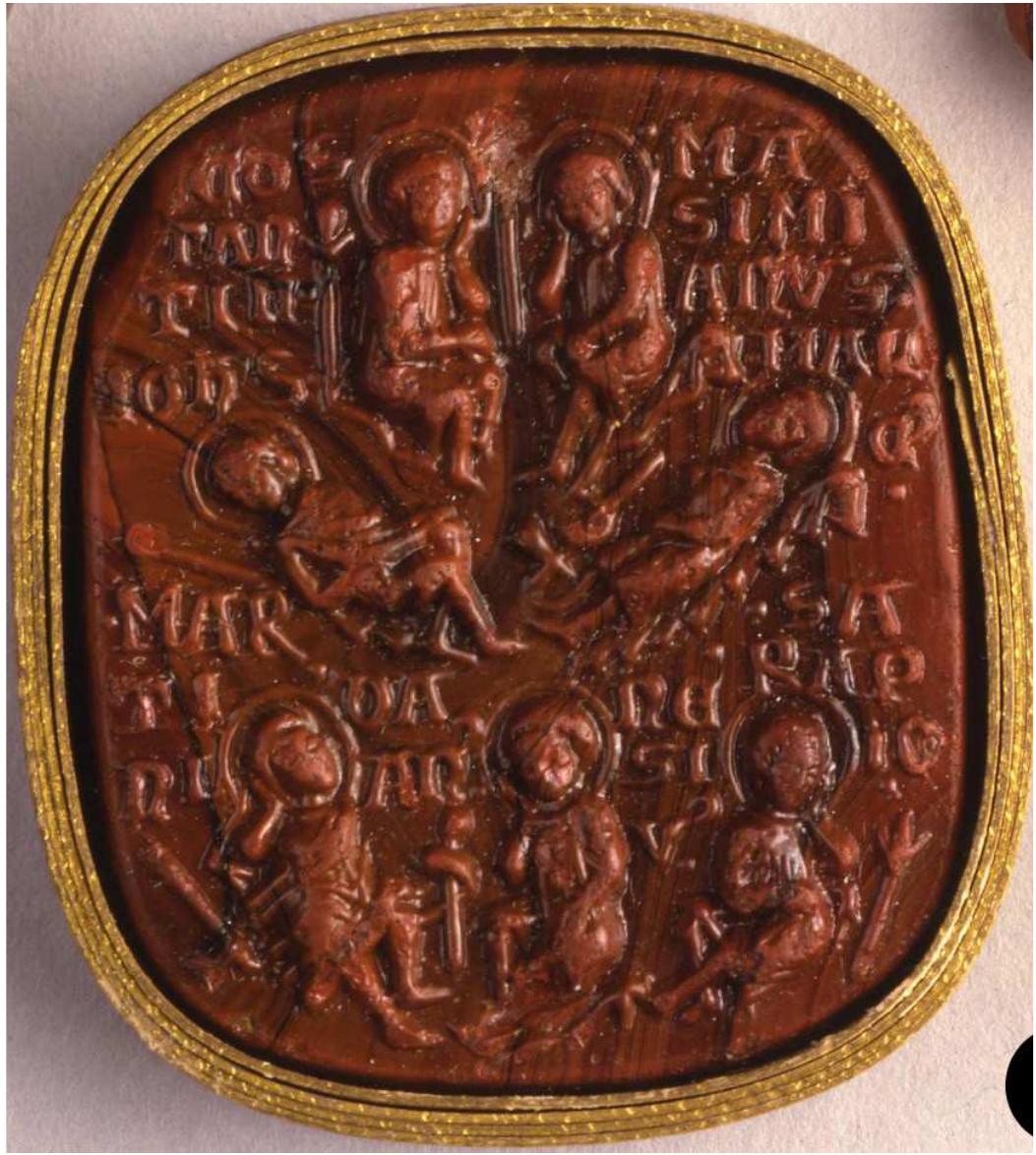Fig. 7. A 13th-century cameo with the Seven Sleepers in low relief. Venice. British Museum, OA.835.  has been well studied in the Christian West. Dominique Rigaux, for example, discusses the shift from the holy image to a drawing that one can carry with him like a talisman or an amulet, and he writes: “this is a borderline case where the use of the image gives the image the role of an object.” We know many examples of Christian talismans bearing the names of the Sleepers and used in various charms against diseases (Fig, 7). Actually, the protective virtue of the Seven Sleepers and of the (or their) dog — and this is a rare mention of this animal in the Christian legend — is quite ancient. It is mentioned in a fifth- or sixth-century Egyptian amulet against illness that is written on papyrus.””  