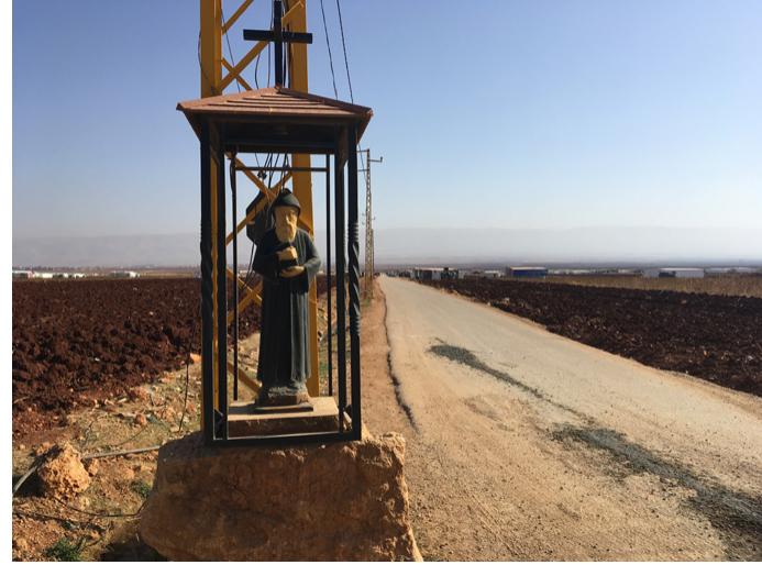 Fig. 7. A shrine dedicated to Saint Charbel on the road leading to Beshwat.  Fig. 5.'The church fortress of Safta.  Fig. 8. An ex-voto at the entry to the village of Safra.  Fig. 6. The largest rosary in the world. 