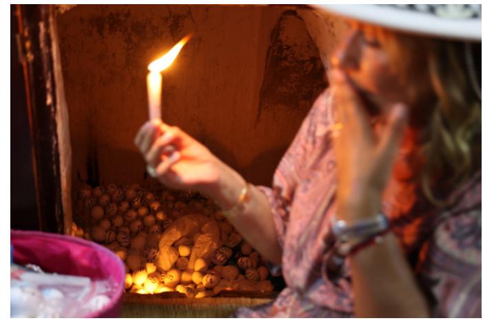 A Woman Pilgrim and Votive Eggs, 2022. Photograph © Manoél Pénicaud. 