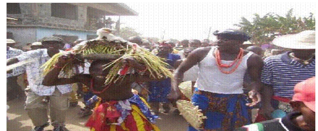In the Ndokwa East Local Government Area, the Ojei festival is observed by two communities, Abot and Ashaka. This is because it is linked to the river gods Ojei and Elishi. According to the people, the object of worship appeared from the river during a dispute between two families in the community after many problems, the gods came as humans and settled the quarrels, and gave peace and bles sing to them. The celebration takes place every year during the dry season, between February anc March (Chief Solomon Egwuenu, Personal Communication, 2020). The Ojei and Elishi are the gods o' peace and blessing; Ojei is a colourfully painted masquerade who performs on land, while Elishi is < masquerade who dances in a canoe on the lake to mark the end of the celebration, all to delight the  aiidience  MEDIATIZATION OF NDOKWA MASQUERADE PERFORMANCES: THE AESTHETIC DYNAMICS OF AN AFRICAN INDIGENOUS CARNIVAL Ruth Etuwe Epochi-Olise and Osakue Stevenson Omoera  object of worship appeared from the river during a dispute between two families in the community; 