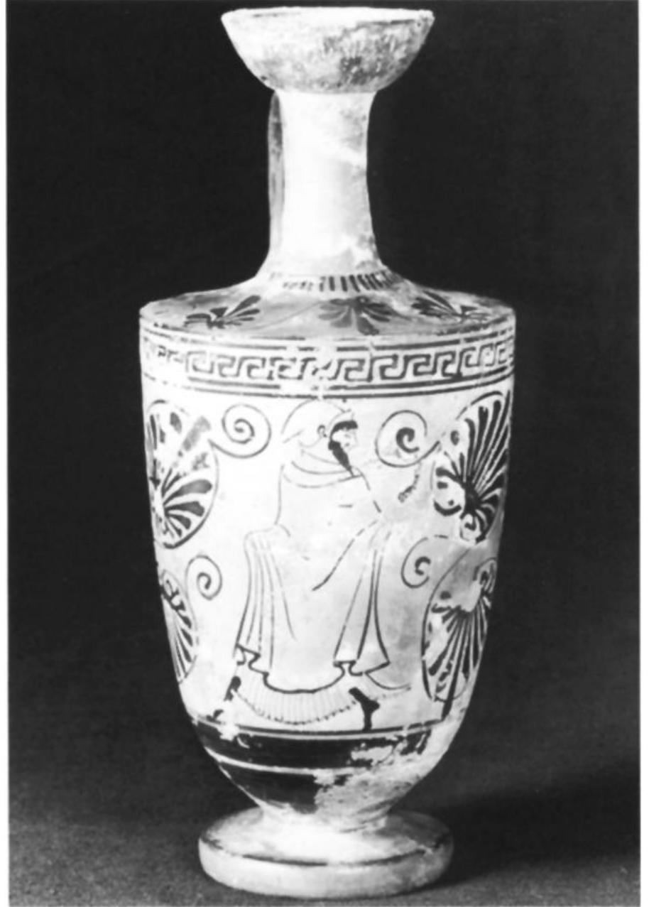 Fig. 19. Attic white-ground lekythos, Painter of Petit Palais 336, 500-480. Komast wearing sakkos and chiton. Paris, Musée du Petit Palais 336. (Photo Bulloz) 