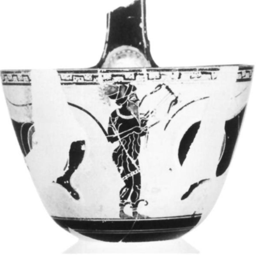 Fig. 20. Attic white-ground kyathos, near Psiax, ca. 520. Single lyre-playing komast with hair pulled through mitra.  Malibu, J. Paul Getty Museum 77.AE.102 + 78.AE.5. Gift of Gianfranco Becchina. (Courtesy Museum) 