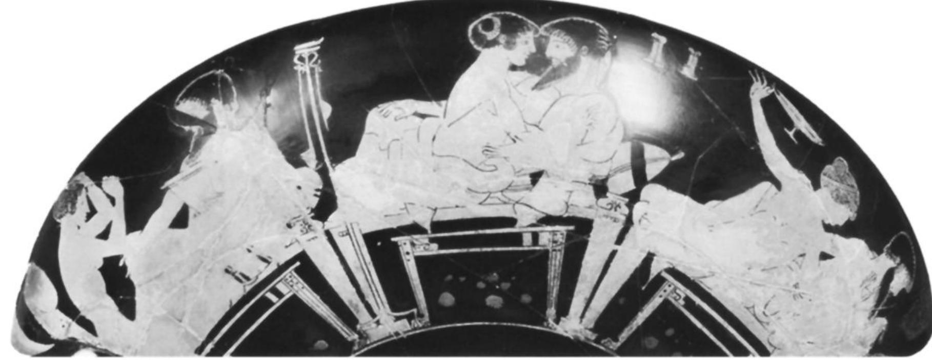 Fig. 22. Attic red-figure cup, Makron, 490-480. Side B: symposium with a hetaira (center) wearing only a himation. New York, Metropolitan Museum of Art, Rogers Fund 1920, inv. 20.246. (Courtesy Museum)  line “costume.”8’ Indeed, Xenophon records the presence of a female pyrrhic dancer at a symposium (Symp. 6.1.12). Occasionally female figures wear the phallic perizoma while dancing in front of Dionysos.88 Thus, the usual context of these figures is Dionysiac, the one clear exception being the pyrrhic dancer for Artemis on the pyxis (figs. 24-25).  side B. Despite their humorous appearance, this can- not be a comic chorus because each man dances in- dependently rather than in step; Csapo proposes to identify them, rather, as transvestite Dionysiac ritual ithyphalloi.89 Other vases show a satyr dressed as a maenad (fig. 28, left figure), and a satyr wearing “fals- ies” (fig. 29).99 An important but little-known black- figure lekythos (fig. 30) attributed to the Haimon Painter in Princeton raises interesting questions. Here, like its better-known parallel in New York, three bearded lyre-playing males alternating with smaller females process around the body.! But there is a significant difference: whereas the men of the New York lekythos wear only mitra and himation, 