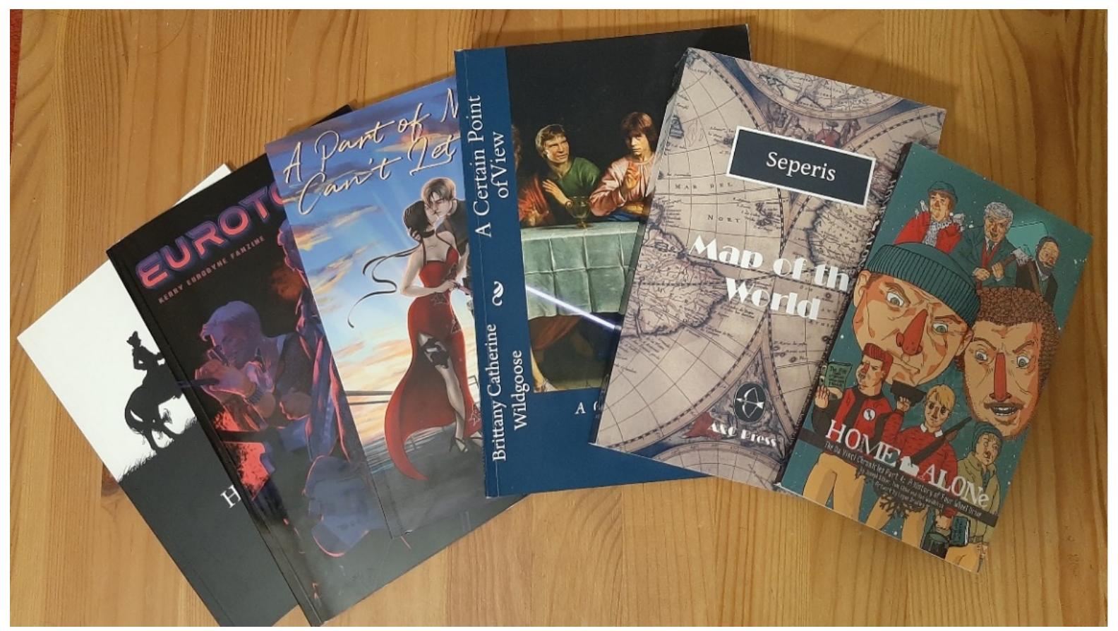 Figure 5. A selection of volumes from the author’s collection of POD-published fiction and fanzines.  8. The (Fanfic) Author as Self-Publisher 